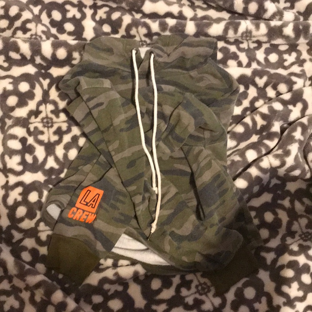 cropped hoodie that’s camo with LA CREW on one of the arm sleeves